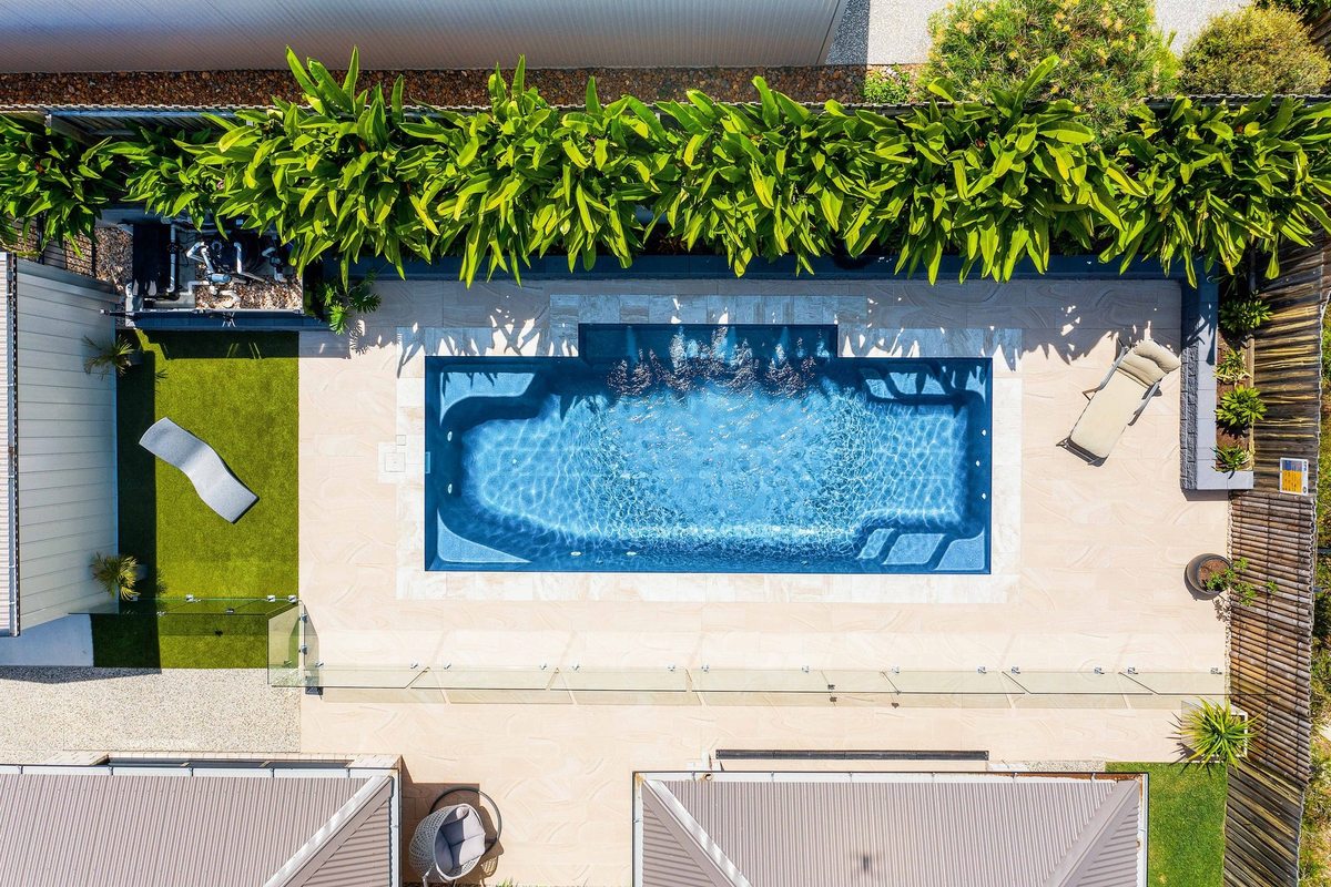Aerial view of a fibreglass pool set into a paved courtyard, from the Wetlife Pool Co gallery