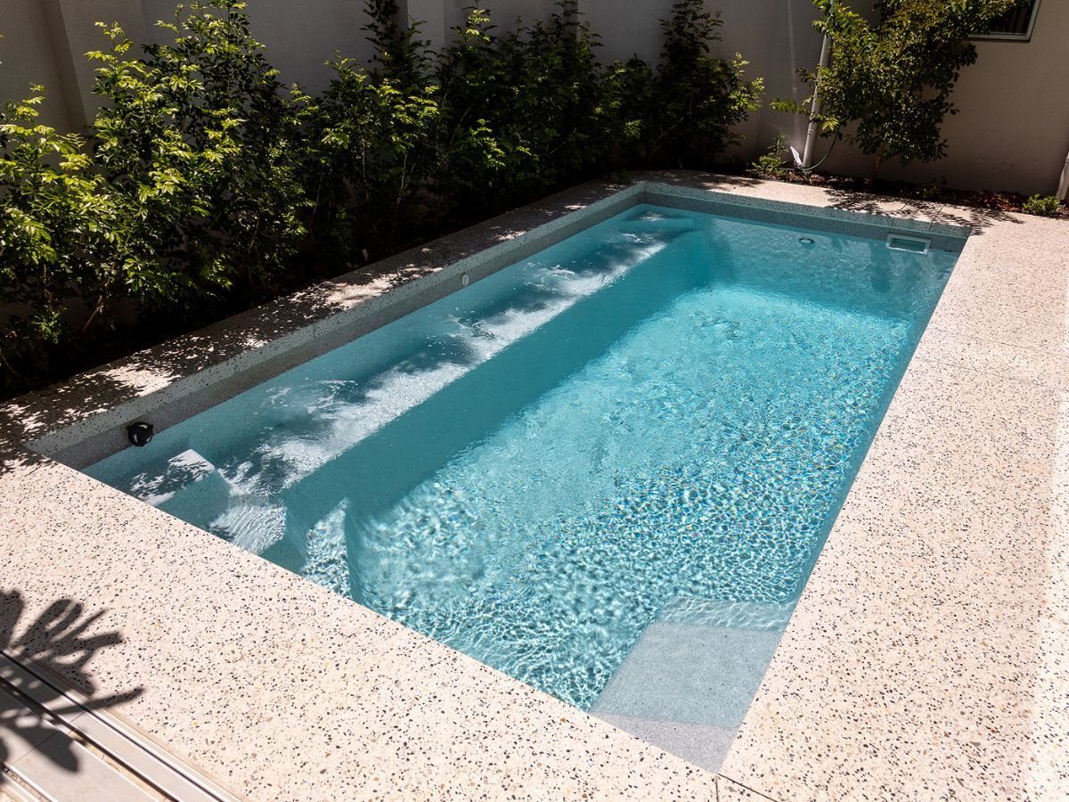Fibreglass pool with entry steps and a sun shelf, from the Wetlife Pool Co gallery