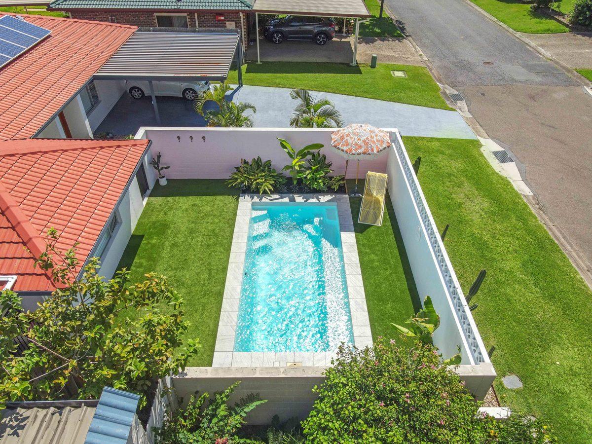 Aerial view of a long fibreglass pool beside a Brisbane home, from the Wetlife Pool Co gallery